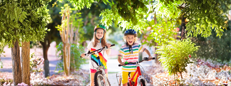 Kids on bike. Children on bicycle. Child biking.